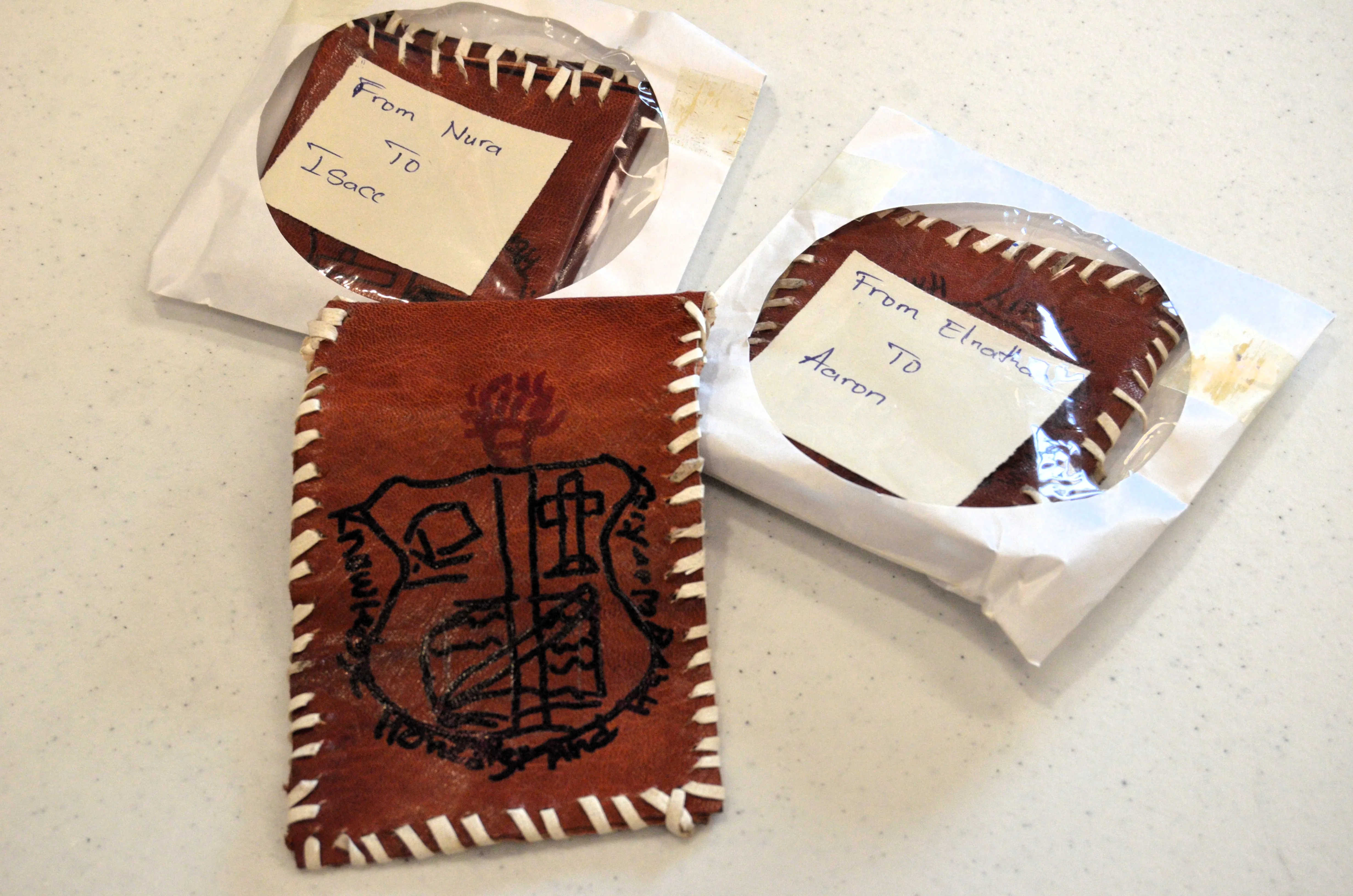 Leather pouches given to St. Luke students by James Browne Memorial students